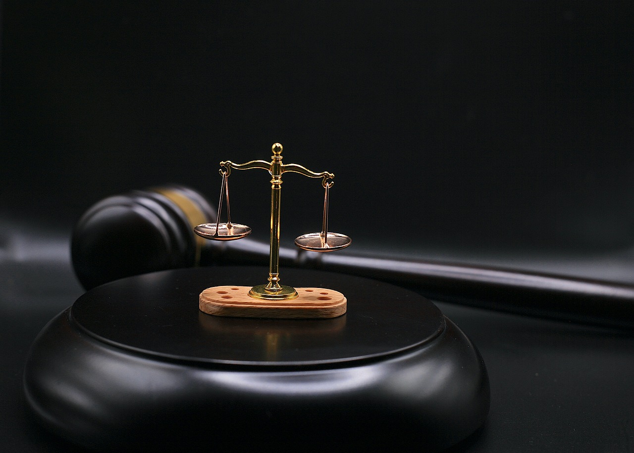 Close-up of a gavel on a wooden desk